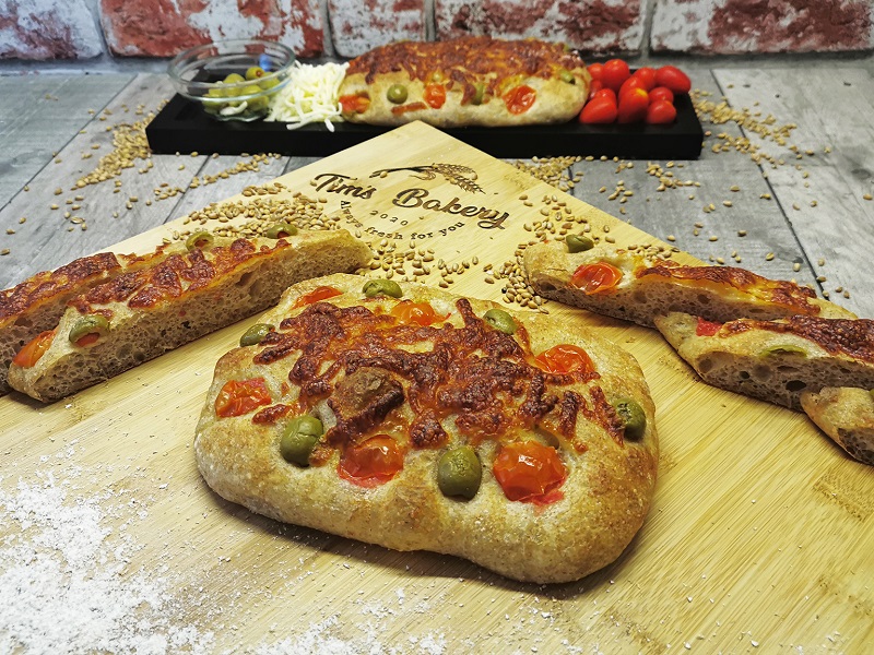 Brown_Focaccia_with_Mozzarella,_Cherry_Tomatoes_&_Green_Olives1